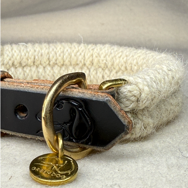 Close up of the Dingley wool rope dog collar on a light woollen background with brass details