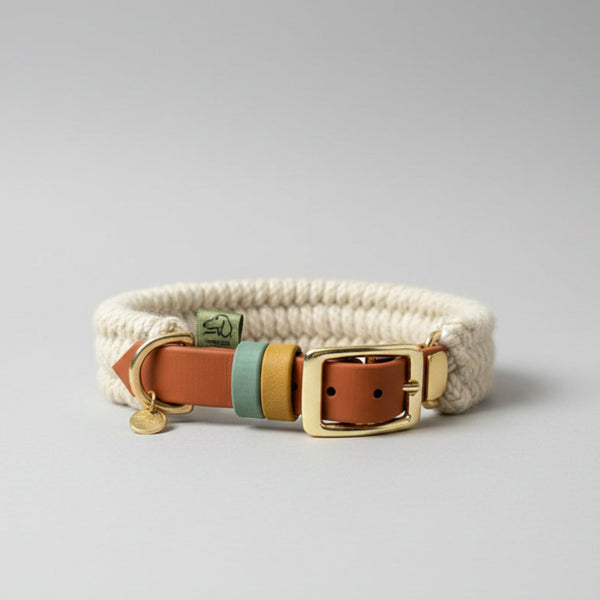 Custom Dingley hybrid dog collar in ecru British wool on a saddle brown 19mm BioThane strap, with sage green and gold keepers, a gold buckle and a brass D-ring