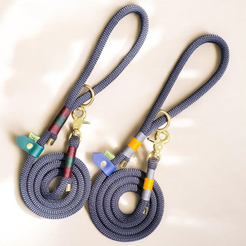 Two customised Greenwich Yarn rope dog leads in midnight blue rope with contrasting two-colour nano binding at the handle