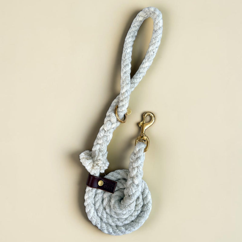 Ecru British wool rope dog lead with brown veg-tanned leather tab and solid brass trigger clip