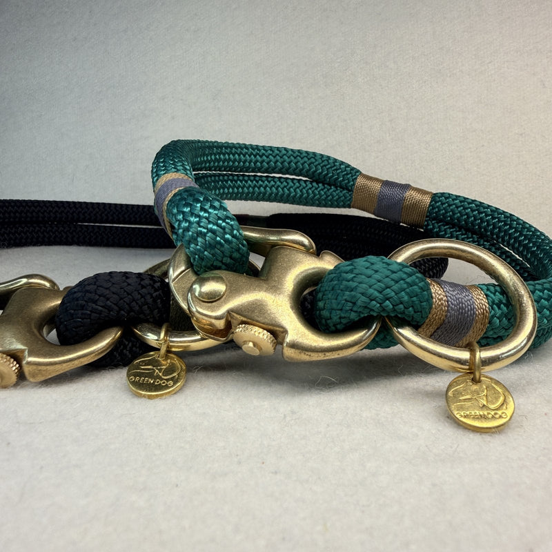 Greenwich Yarn designer dog collars, the Midnight Edition in black and one in hunter green rope with tan and charcoal grey nano binding and brass hardware