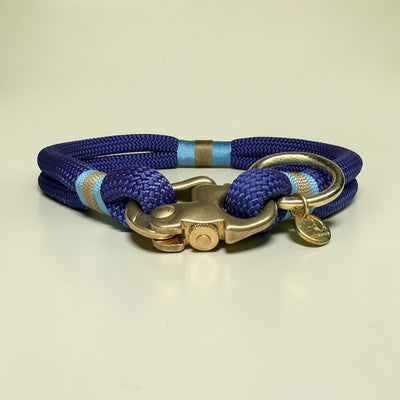 Marine blue rope dog collar with Carolina blue and beige nano cord binding and solid brass clasp and O-ring