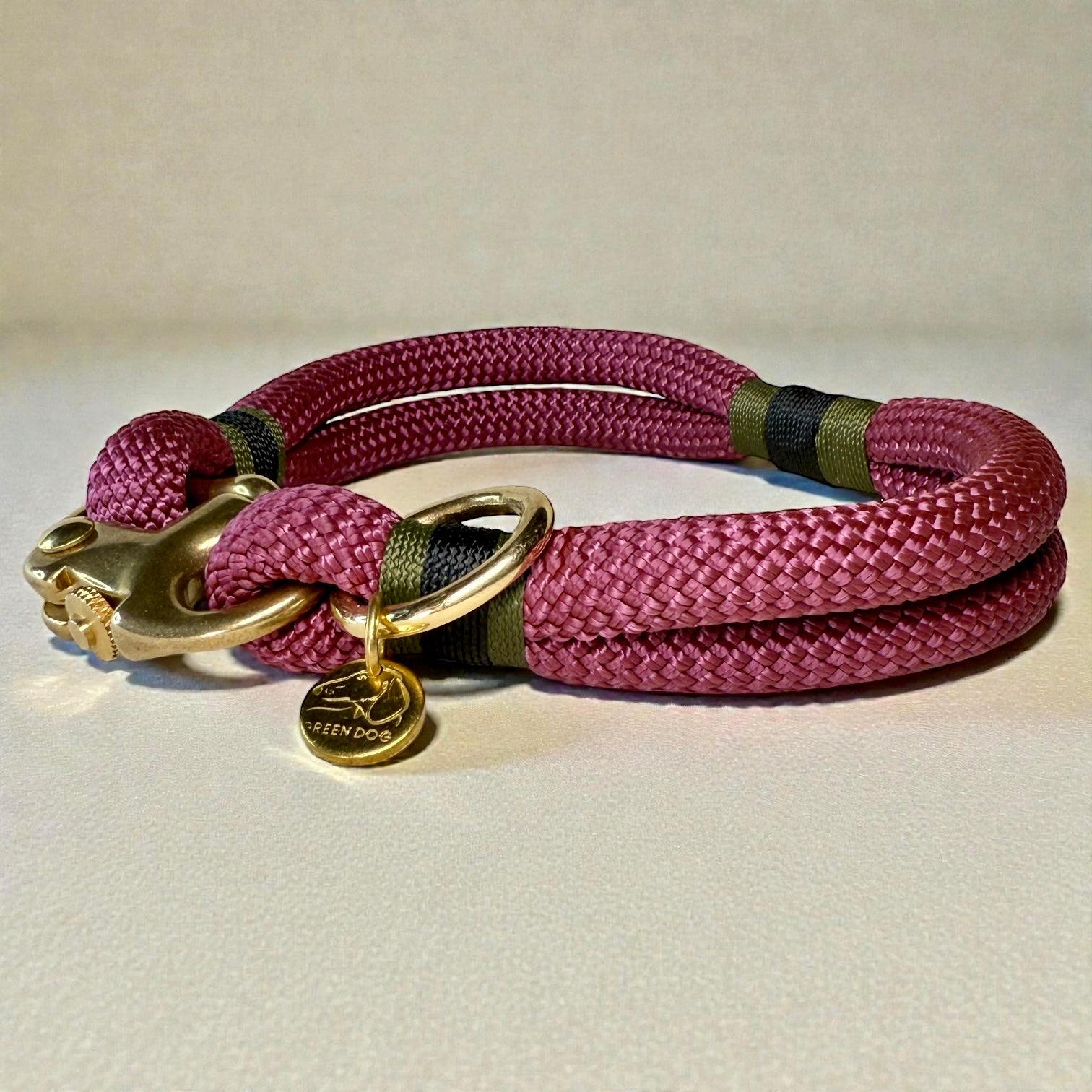 A side on shot of the Bordeaux Greenwich Yarn rope dog collar with maroon rope, olive drab and black binding and brass detail