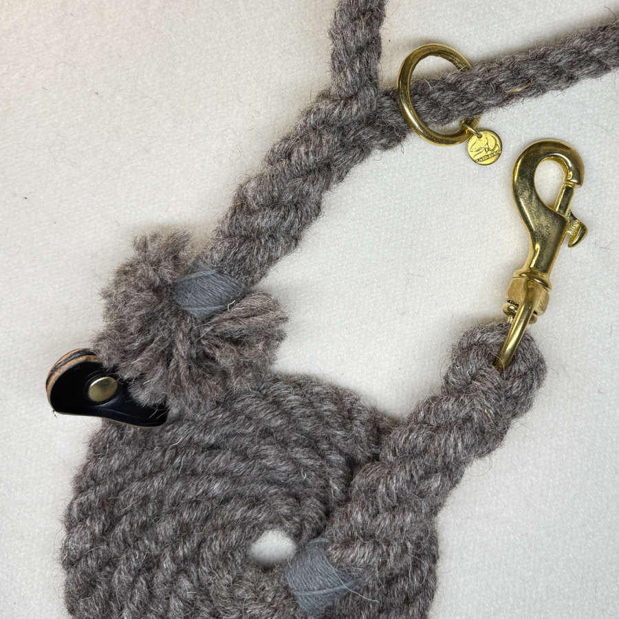 Close up of the brampton wool rope dog lead with brass hardware and black bridle leather detail