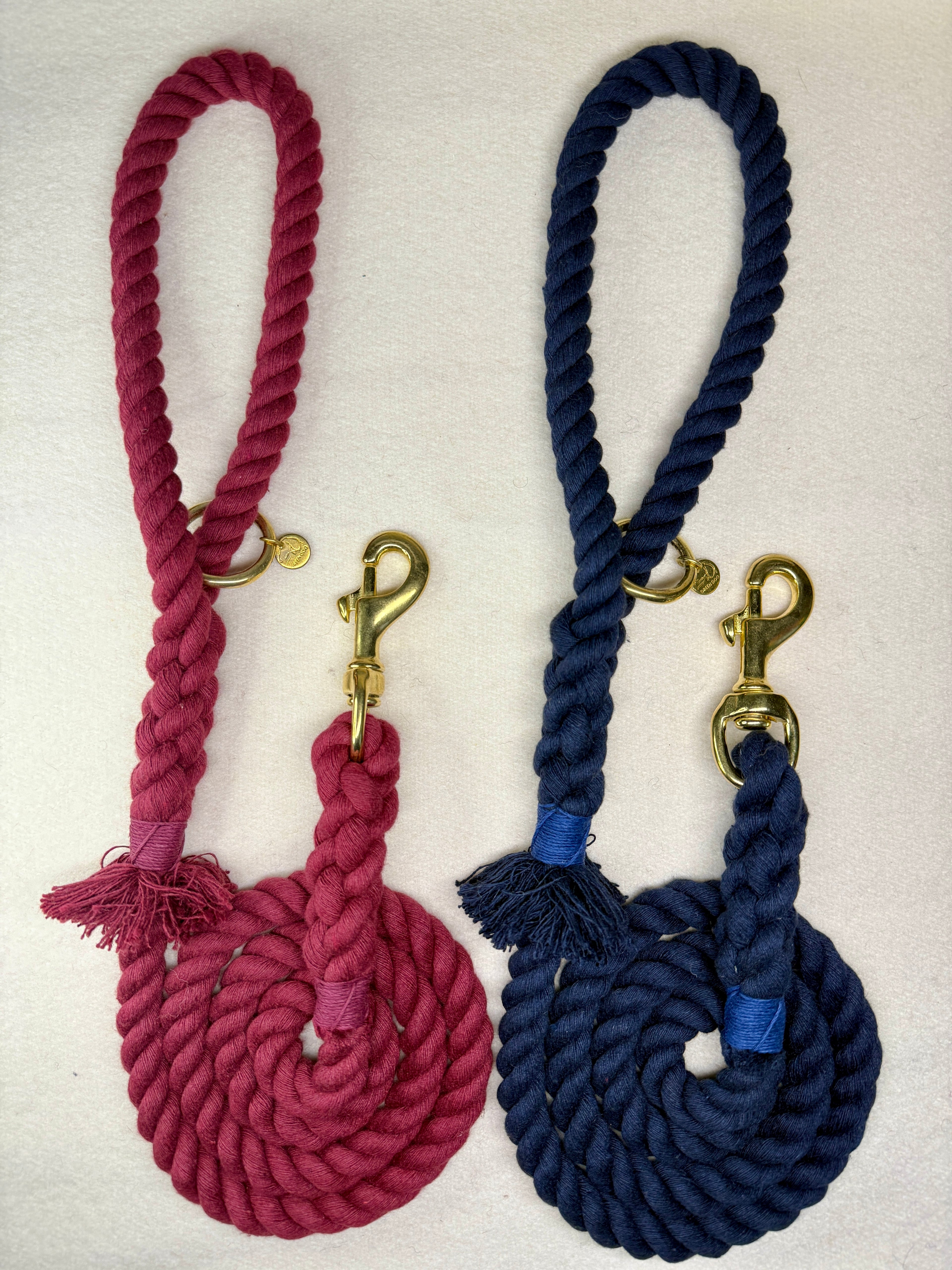 Full view of the Midnight blue and burgundy braided cotton rope dog leads with brass details
