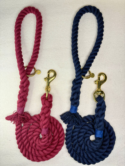 Full view of the Midnight blue and burgundy braided cotton rope dog leads with brass details