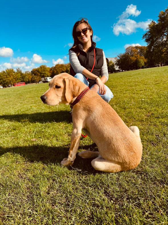 Cassa Jackson and her dog Sunny using the Greenwich Yarn handsfree adjustable dog lead during an outdoor walk.