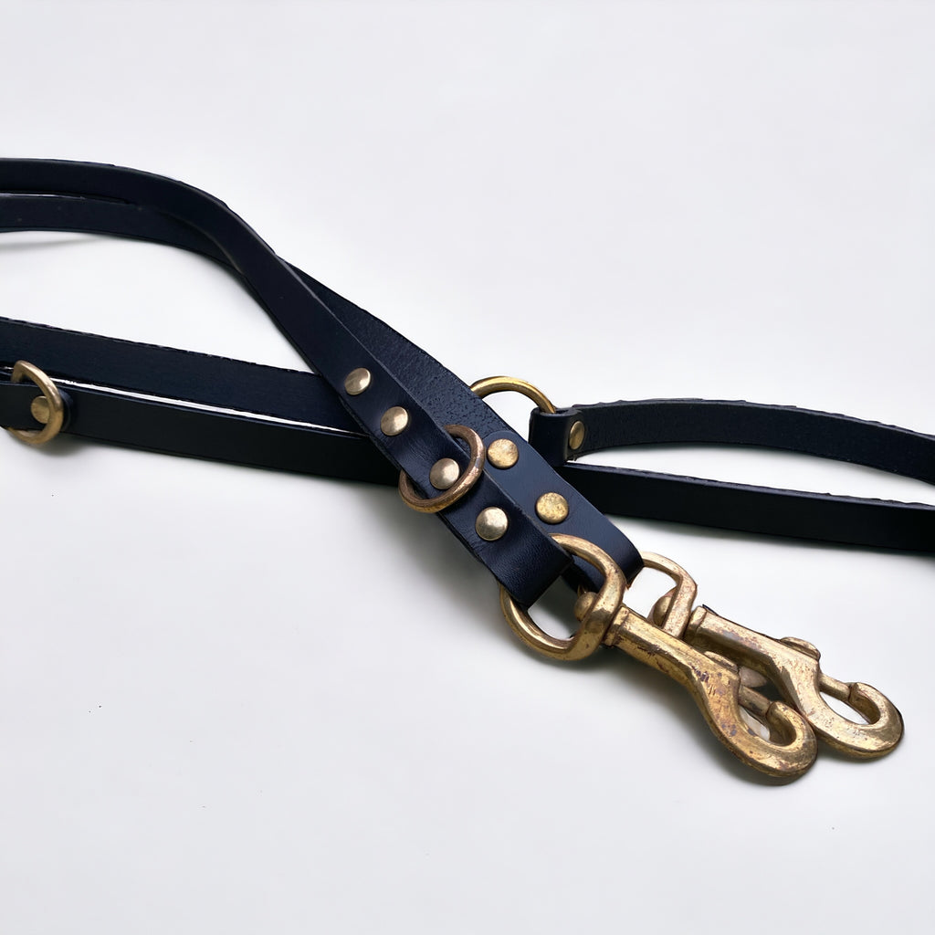 Close-up of Green Dog’s black handmade luxury leather hands free dog lead, crafted with premium cowhide and brass hardware.
