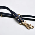 Close-up of Green Dog’s black handmade luxury leather hands free dog lead, crafted with premium cowhide and brass hardware.