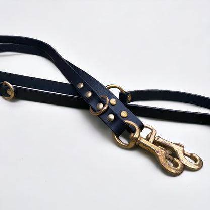 Close-up of Green Dog’s black handmade luxury leather hands free dog lead, crafted with premium cowhide and brass hardware.