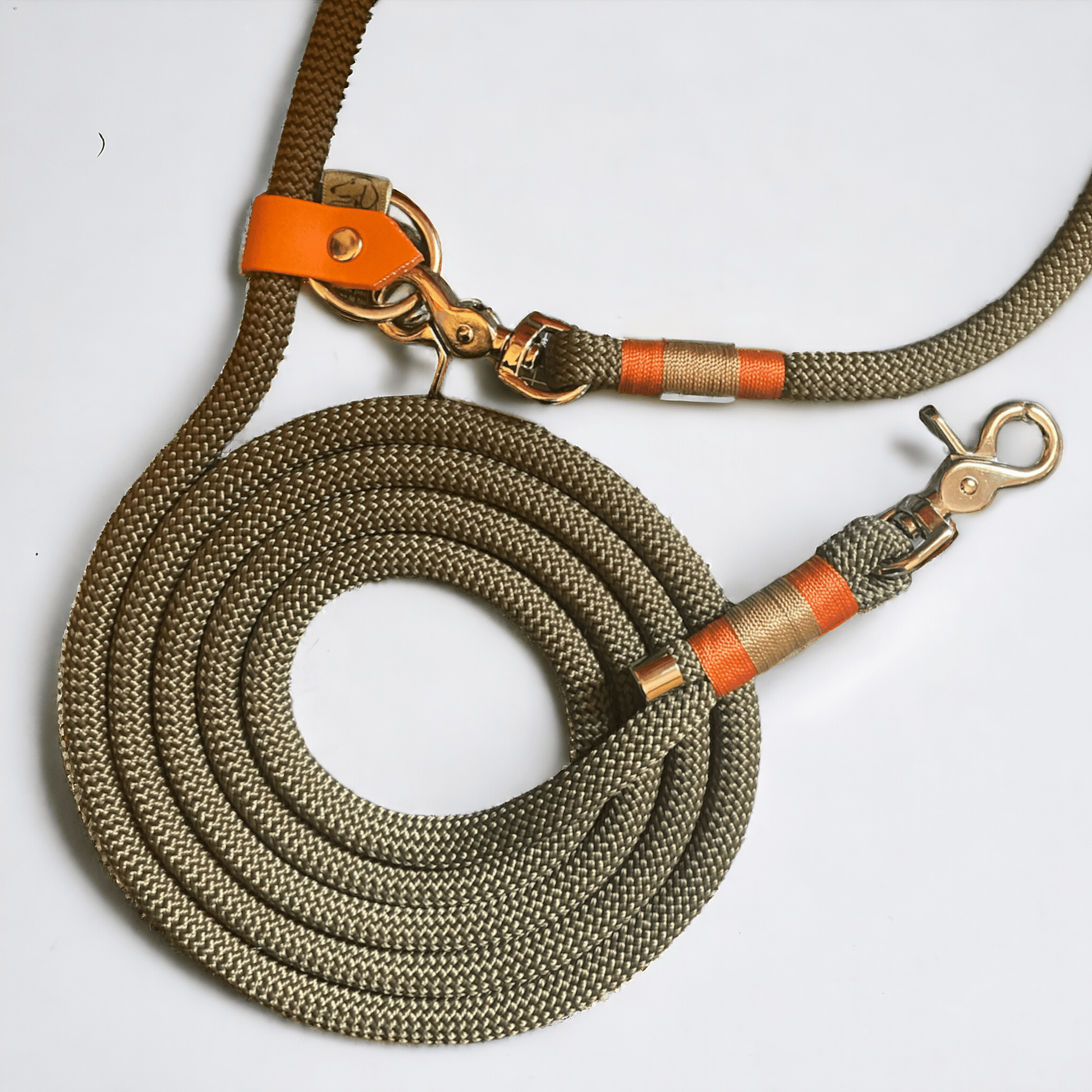 Close-up of the Greenwich Yarn handsfree adjustable dog lead in Nala Green, showcasing the BioThane adjustable slider and premium gunmetal hardware.