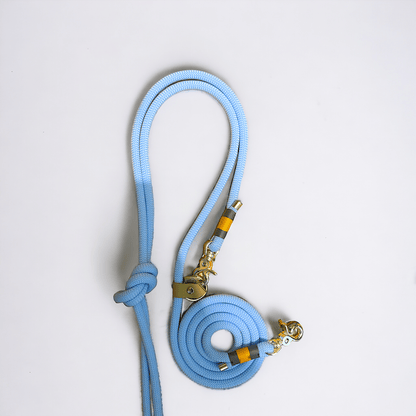 Close-up of the Greenwich Yarn handsfree adjustable dog lead in Monkey Blue, with charcoal grey and airforce gold binding.