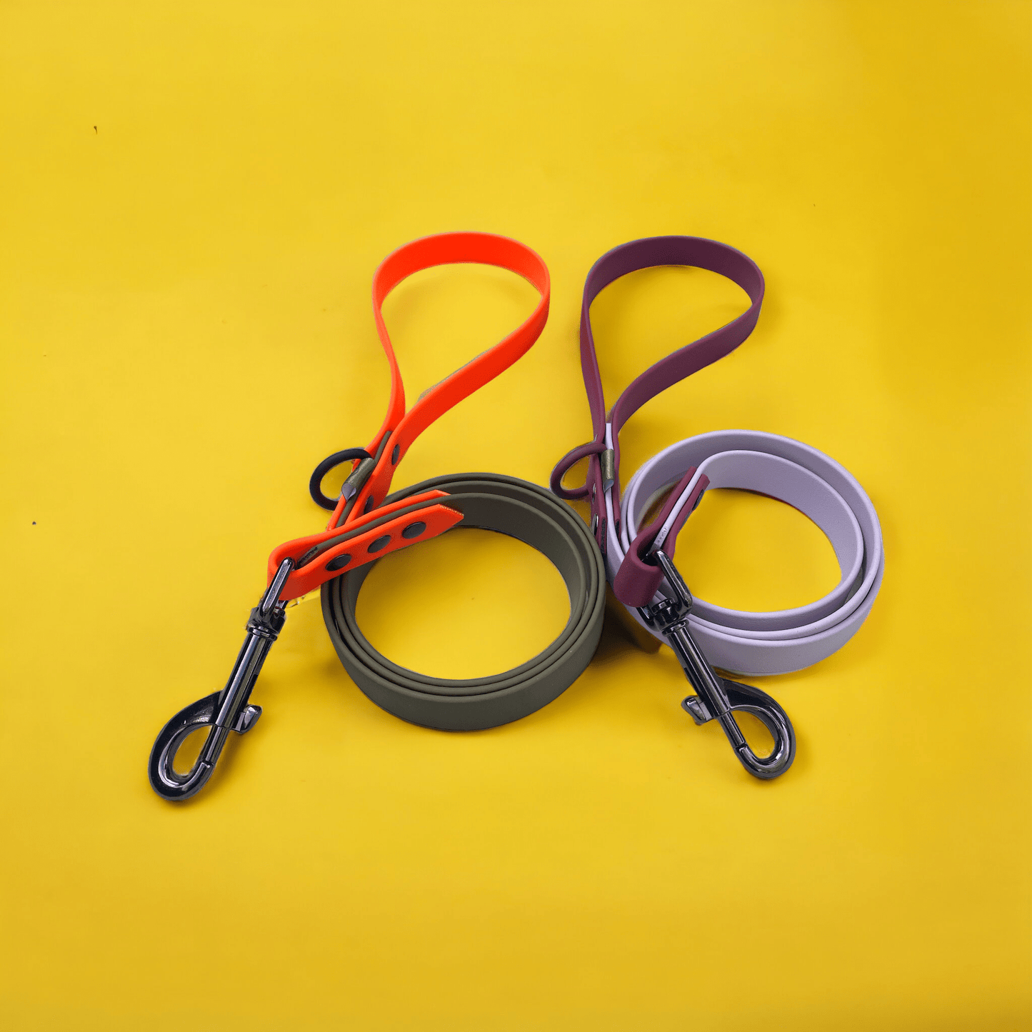 Two custom BioThane dog leads in different colour options, crafted for durability and waterproof performance.