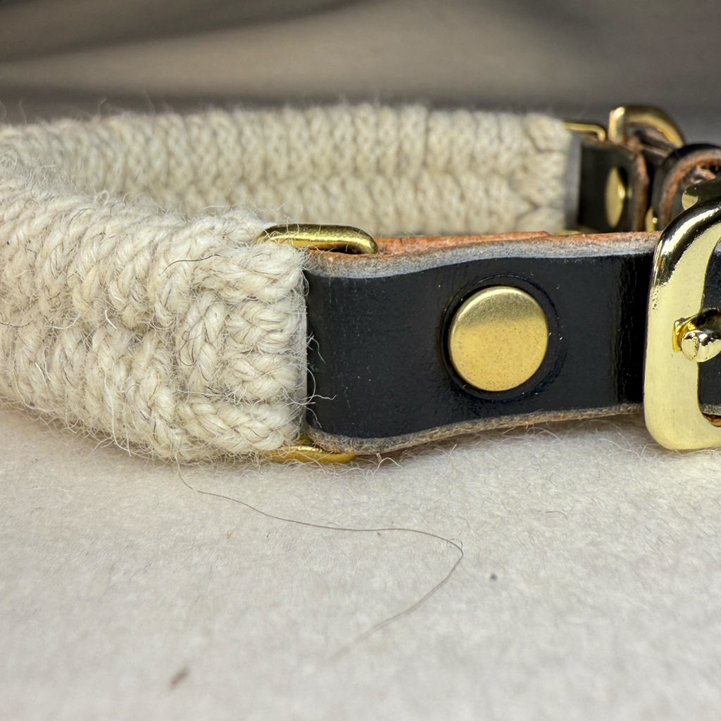 a side on close up of the Dingley wool rope dog collar with black bridle leather collar adjuster and brass hardware
