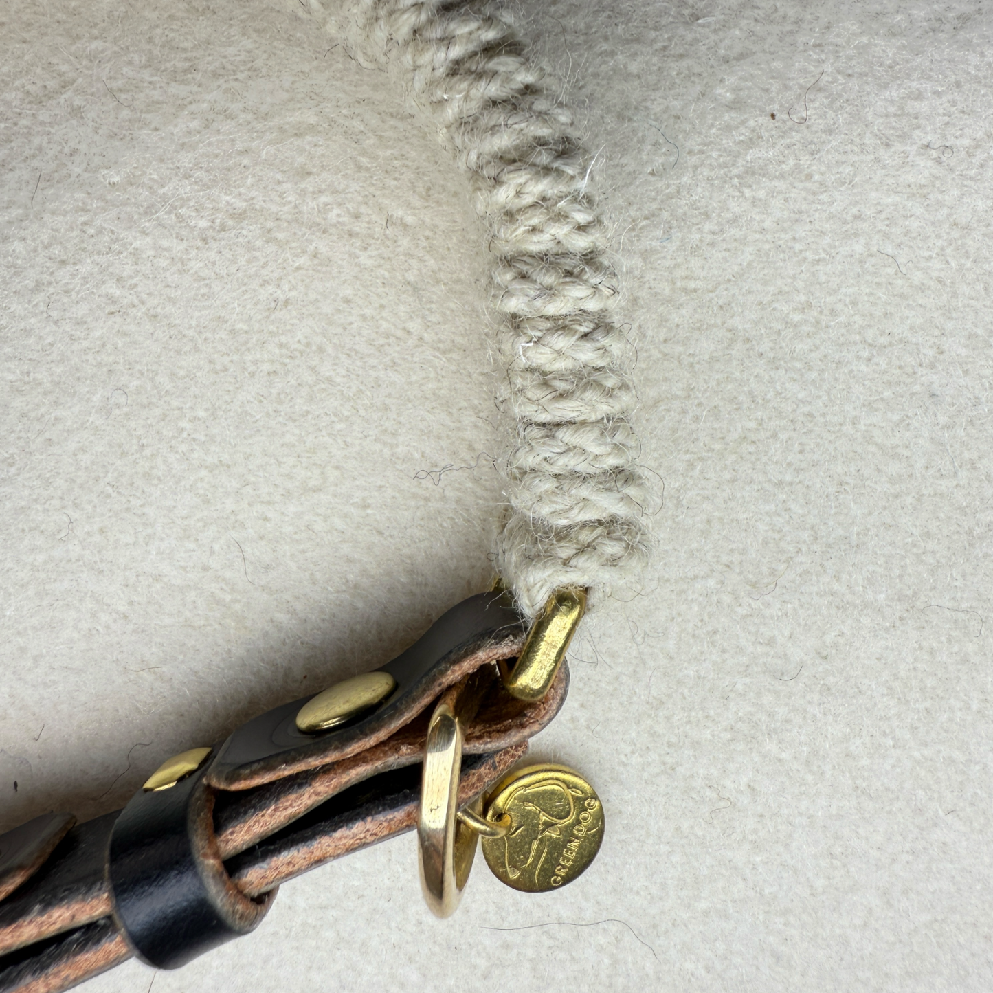 a side arial profile of the Dingley wool rope dog collar with brass hardware and black bridle leather collar adjuster