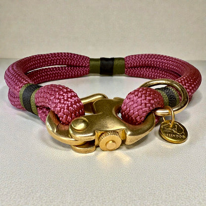 Front view of the greenwich yarn dog collar Bordeaux edition with Maroon rope, olive drab and black bound detail and brass fittings 