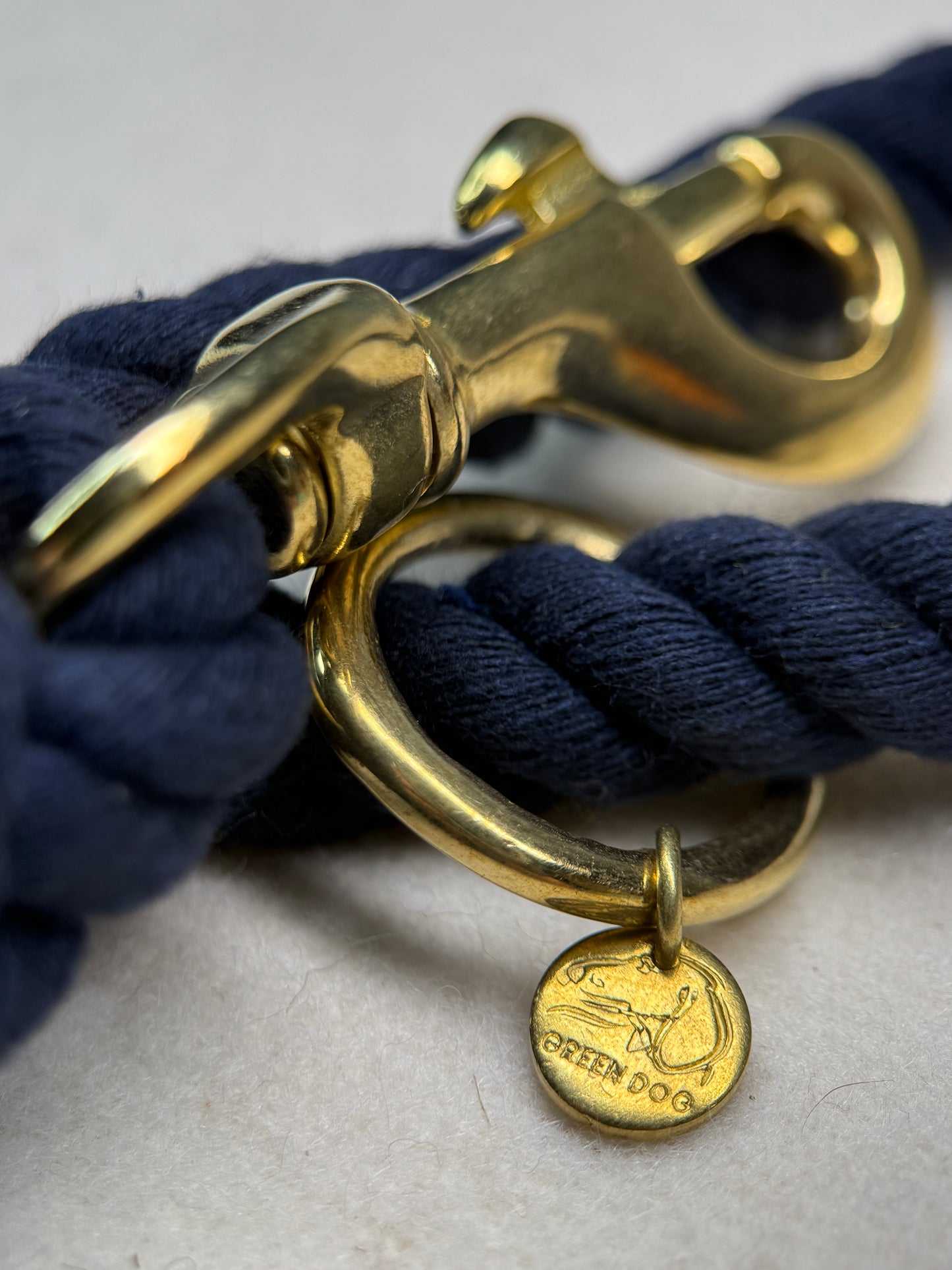 Close up of the midnight blue braided cotton rope dog lead with brass detail