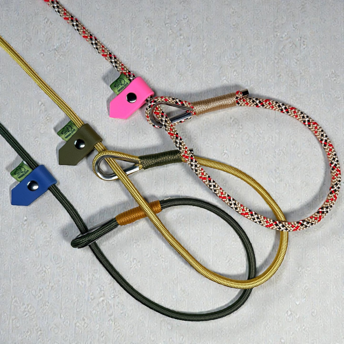 Three slip lead variations, fully customisable slip leads for dogs. Olive Drab, Gold and Tartan 6mm ropes with Caramel, Military Green and Beige bindings. Finished with Green Dog’s signature BioThane stoppers for a secure fit in Petrol Blue, Military Green and Pastel Pink BioThane