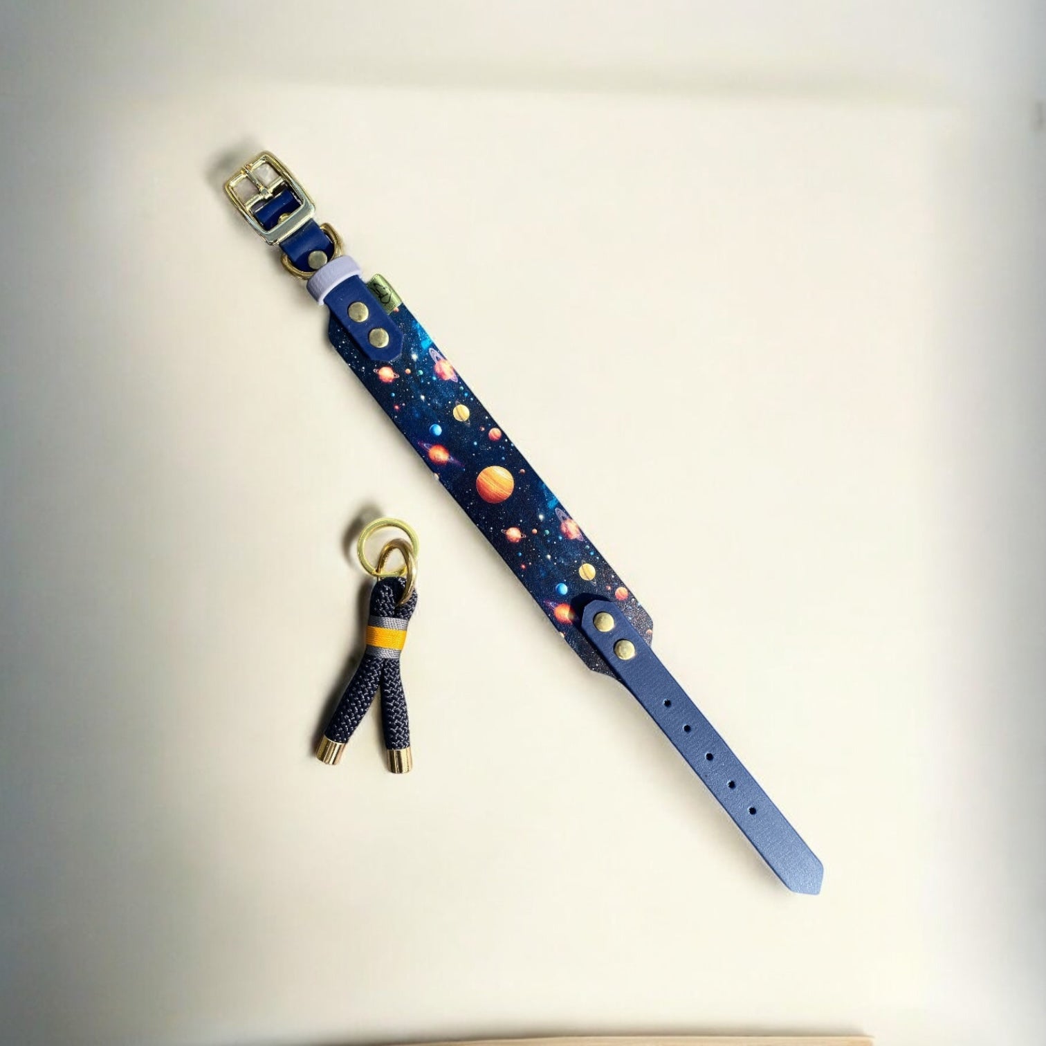 The Space Monkey Dog Collar next to the matching Greenwich Yarn keychain