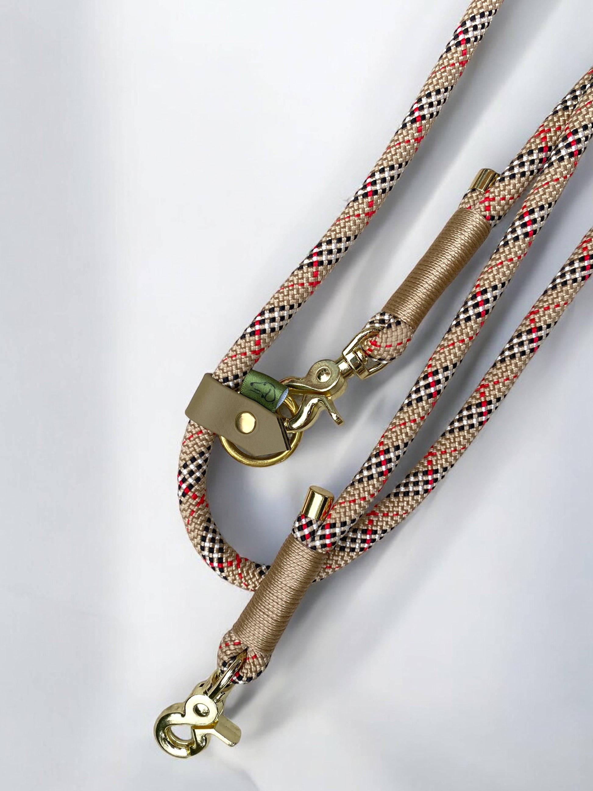 Handsfree rope dog lead featuring tartan rope, beige binding, and gold hardware.
