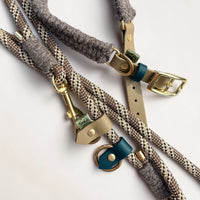 Close-up of Brampton Hybrid collar and lead together — beige BioThane strap with teal keeper and brass D-ring on collar, solid brass snap clip and beige BioThane stopper on chestnut rope lead, Sheep Shed Hybrid collection by Green Dog