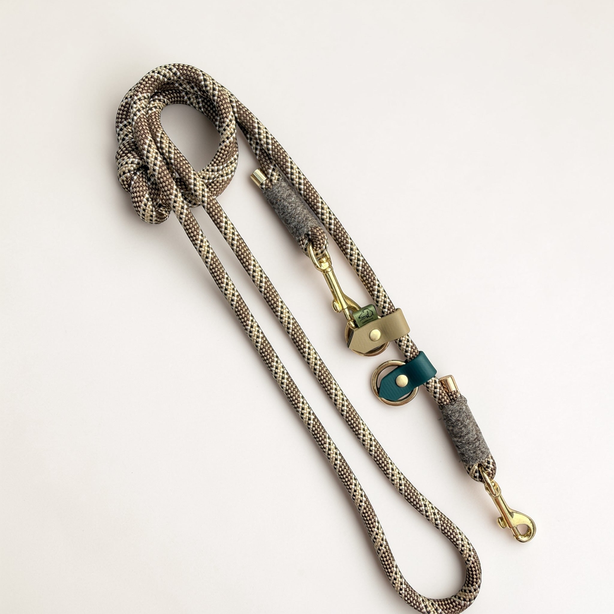 Brampton Hybrid rope dog lead in chestnut PPM rope — beige BioThane stopper at handle, Brampton grey wool binding, teal BioThane loop tab, solid brass clip and O-ring, Sheep Shed Hybrid collection handmade in Oxford