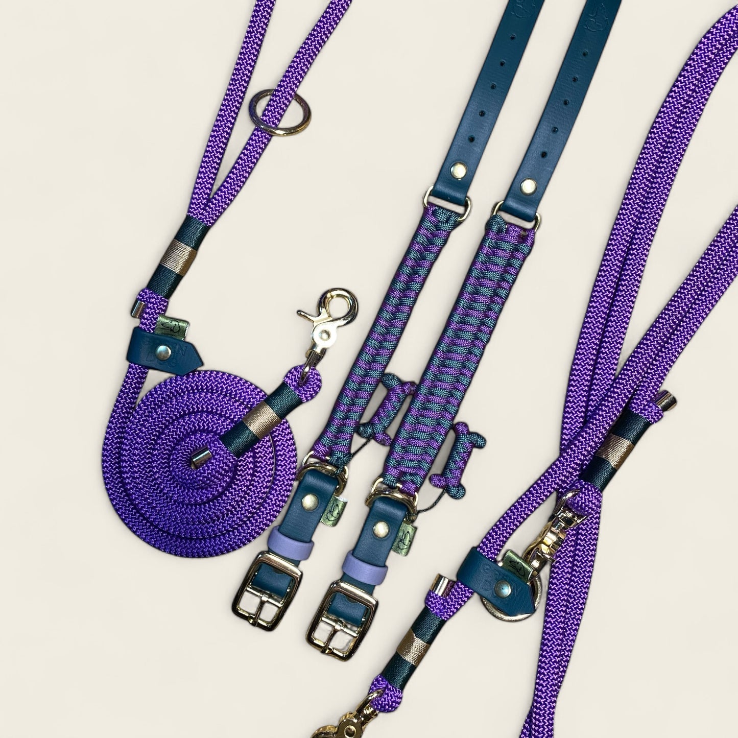 Centre Court dog collar and lead set featuring the Fishtail and 3-row weave collars with matching hands-free rope lead and classic clip lead in alpine green and deep purple, handmade by Green Dog.