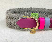 Close-up of the Brampton hybrid collar showing the charcoal wool weave, maroon BioThane strap, pink and grey 9mm keepers and the Green Dog woven label