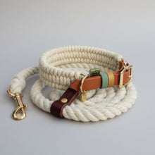 Custom Dingley hybrid collar in ecru wool and saddle brown BioThane, coiled with a cream rope lead, leather tab and solid brass trigger hook