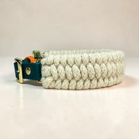 Close-up of Dingley heritage wool weave texture on the Dingley Hybrid dog collar — cream British wool 4-row wide weave with hunter green BioThane strap and solid brass buckle, handmade in Oxford