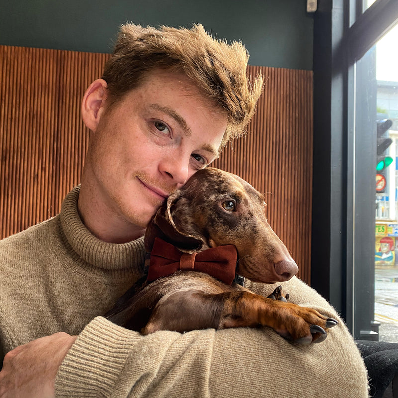 Green Dog founder Ed with his dachshund, Boris, showcasing the passion behind handcrafted eco-friendly dog collars and leads. Sustainable and bespoke dog accessories for eco-conscious dog lovers.