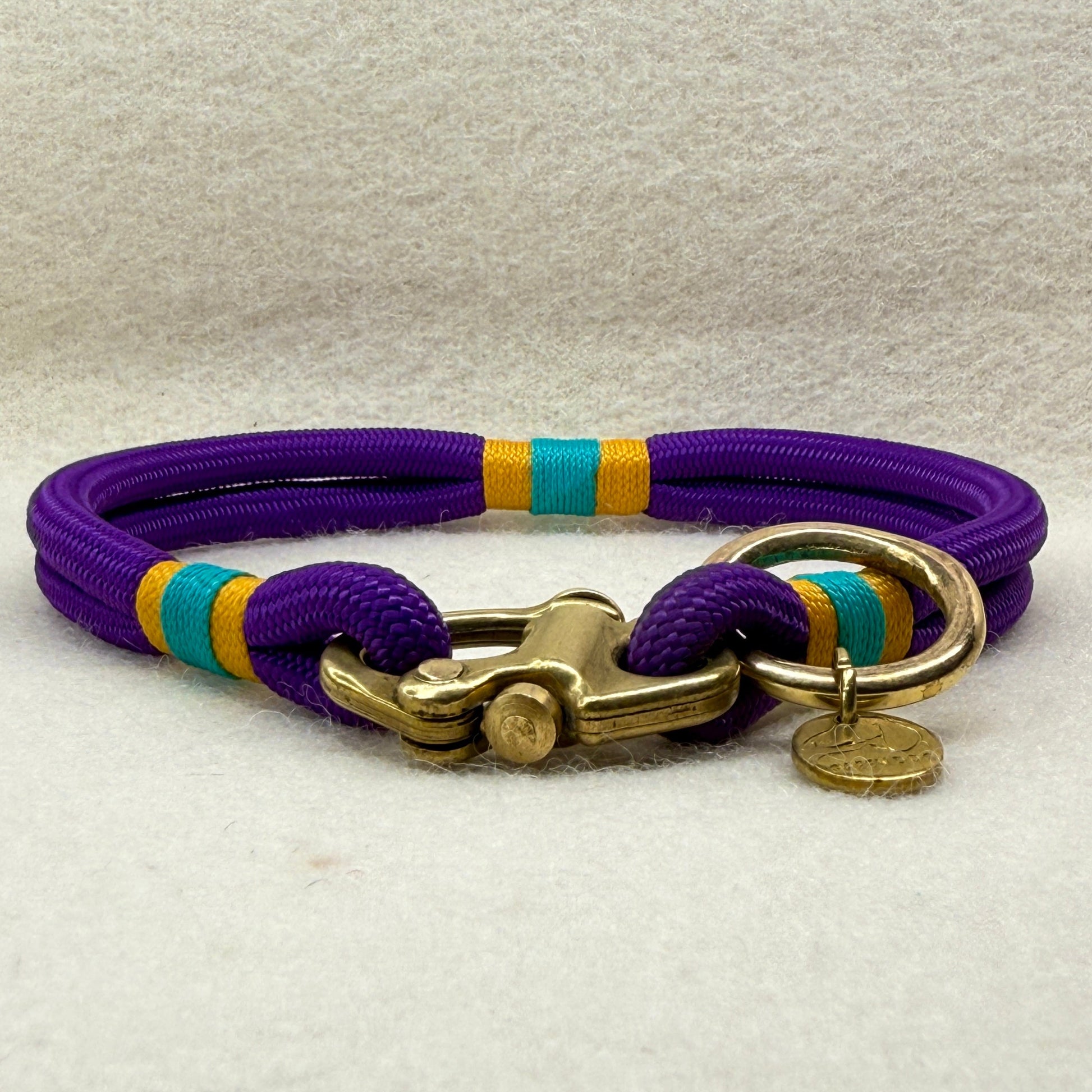 Greenwich Yarn mini rope dog collar (6mm) in deep purple with airforce gold and teal nano binding, solid brass shackle and small brass O-ring