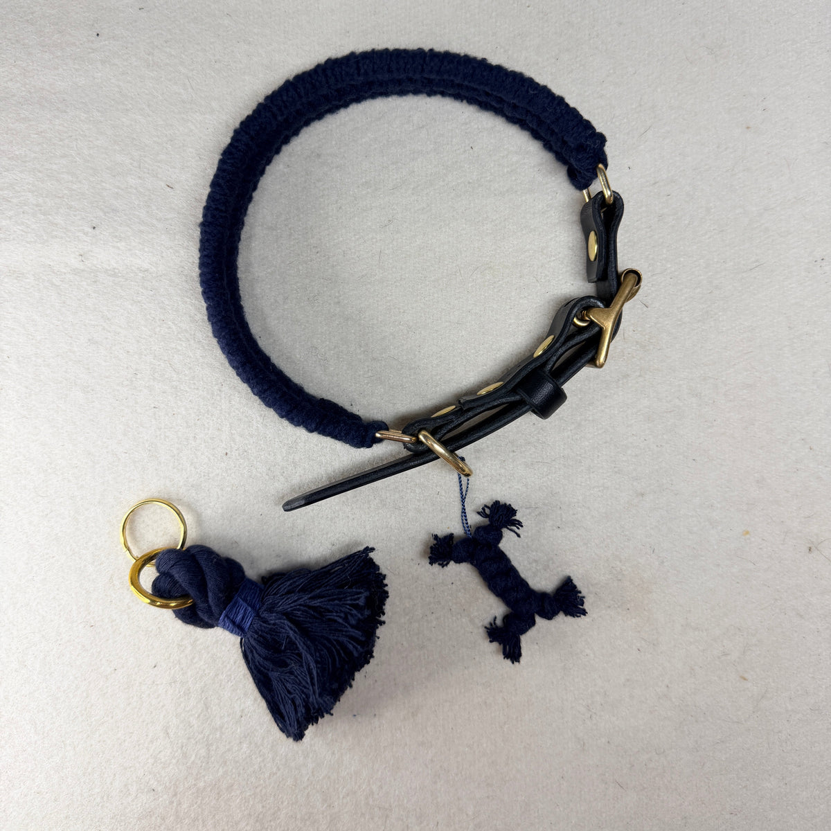 Midnight blue cotton dog collar from above with matching 12mm cotton rope keyring and navy bone charm, handmade in Britain